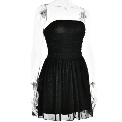 A mannequin wearing a strapless black dress with a full skirt.